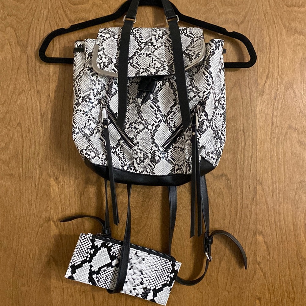 Snake print backpack with zipper wallet.